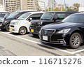 Cars in a parking lot 116715276