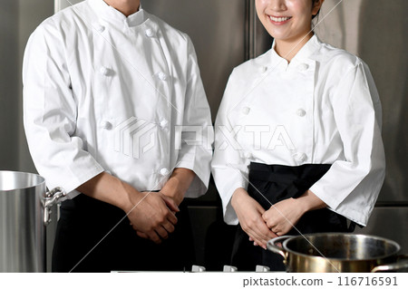Young asian male and female chefs cooking in the kitchen Young asian male and female chefs cooking in the kitchen 116716591