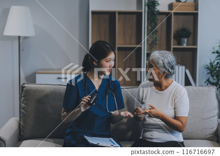 Doctor consulting with patient discussing something and Presenting results on report, Medicine and health care concept. 116716697