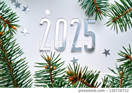 Abstract light Christmas background with stars and a Christmas tree with the year number 2025. Abstract light Christmas background with stars and a Christmas tree with the year number 2025. 116716722