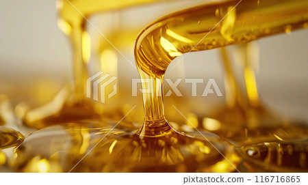 Golden oil flowing in a stream. 116716865