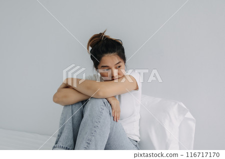 Sad and depressed woman stay alone in the room. 116717170