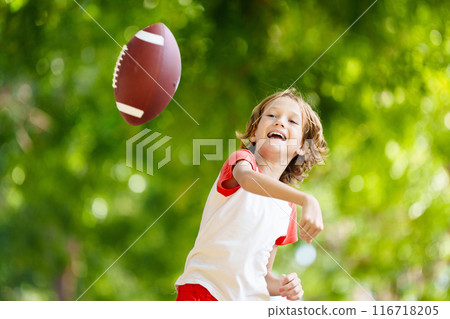 Family playing American football. Kids play rugby Family playing American football. Kids play rugby 116718205