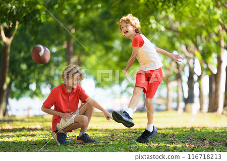 Family playing American football. Kids play rugby 116718213