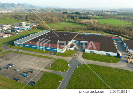 Aerial view of new factory building for producing and shipping of industrial equipment Aerial view of new factory building for producing and shipping of industrial equipment 116718914