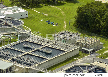 Aerial view of modern water cleaning facility at urban wastewater treatment plant. Purification process of removing undesirable chemicals, suspended solids and gases from contaminated liquid 116718918