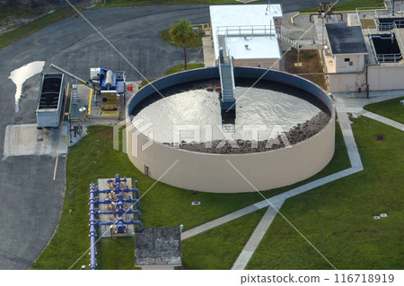 Aerial view of modern water cleaning facility at urban wastewater treatment plant. Purification process of removing undesirable chemicals, suspended solids and gases from contaminated liquid 116718919