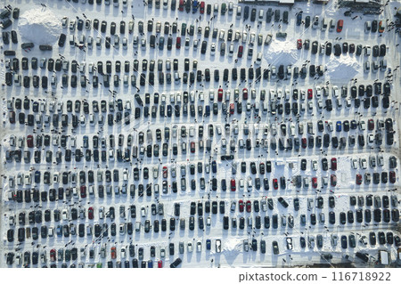Aerial view of many cars parked for sale and people customers walking on car market or parking lot in winter 116718922