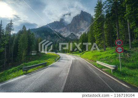 Road in alpine mountains at sunset in summer. Dolomites, Italy 116719104
