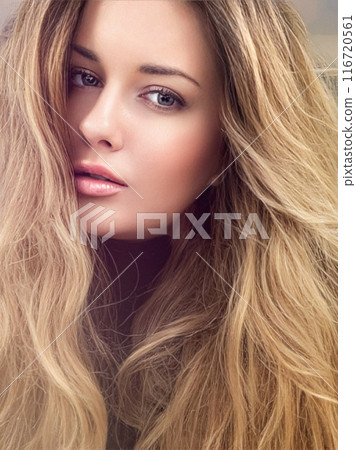 Beautiful modern blonde woman with volume hairstyle, long luxurious hair and beauty makeup, glamorous look face portrait for luxury fashion and natural cosmetics idea 116720561