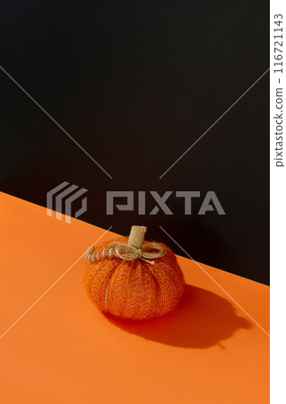 Autumn handmade textile decoration on orange table. Cozy fabric pumpkin. Thanksgiving decor. Autumn handmade textile decoration on orange table. Cozy fabric pumpkin. Thanksgiving decor. 116721143