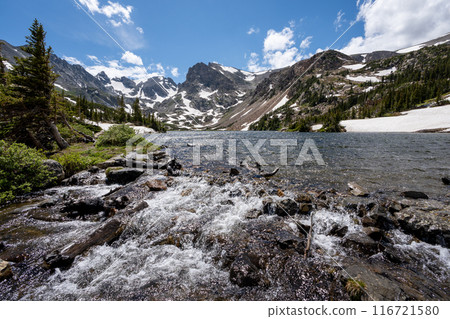 Lake Isabelle in Indian Peaks Wilderness, Colorado under sunny summer clouds. 116721580
