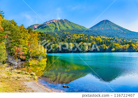 Hokkaido Onneto dyed in autumn leaves - Mt. Meakan and Mt. Akan Fuji reflected on the lake surface - 116722407