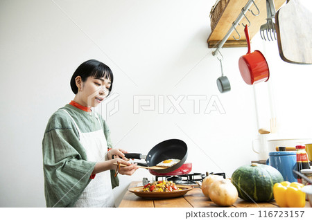 Young woman making gapao rice Young woman making gapao rice 116723157
