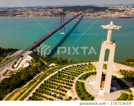 Aerial panorama view over the 25 de Abril Bridge and Statue of Jesus Aerial panorama view over the 25 de Abril Bridge and Statue of Jesus 116723659