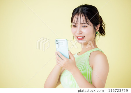 Lifestyle A woman looking at a smartphone 116723759