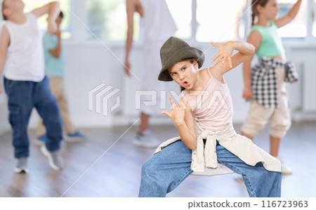 Tween girl mastering krump dance in children dance studio 116723963
