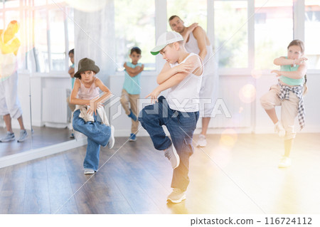 Tween boy dancer rehearsing krump dance in kids studio 116724112