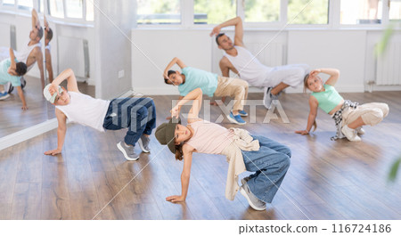 Tween girl mastering krump dance in children dance studio 116724186