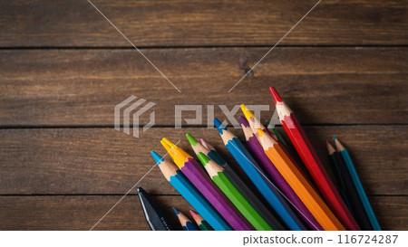 AI content. Wooden background with set of school student. 116724287