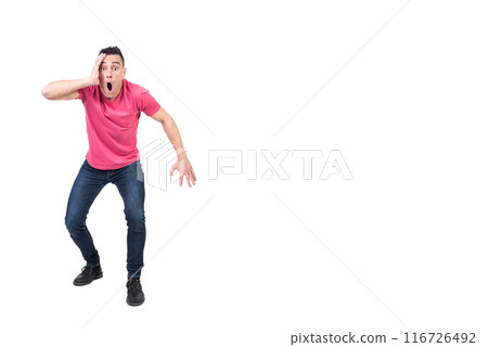 Shocked man standing in studio. White background 116726492