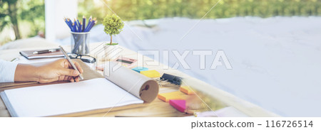 Banner woman working office desk reading financial report finance chart graph on table. Wide tax audit woman hands working paperwork office. Banner Businesswoman Audit financial with copy space 116726514