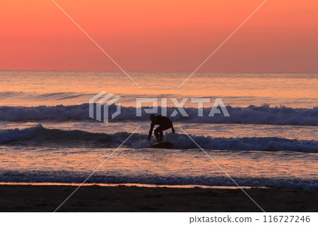 Surfers on the shore of Miyazaki's Okuragahama Beach at sunrise 116727246