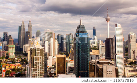 Aerial view of the silhouette of skyscrapers and the city center of Kuala Lumpur. Aerial view of the silhouette of skyscrapers and the city center of Kuala Lumpur. 116727816