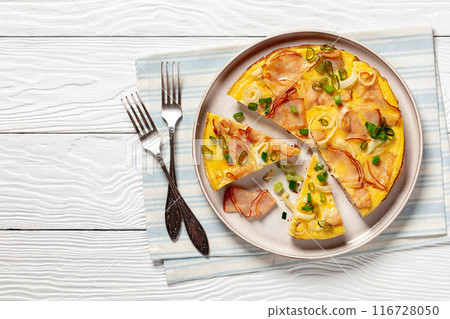 deli ham onion omelette on skillet, top view deli ham onion omelette on skillet, top view 116728050