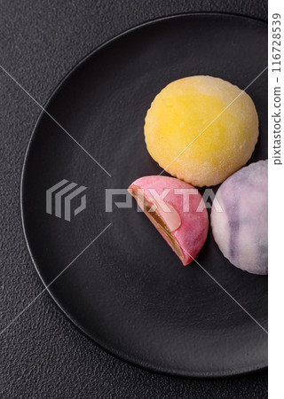 Delicious sweet chilled mochi desserts with fruit filling Delicious sweet chilled mochi desserts with fruit filling 116728539