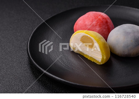 Delicious sweet chilled mochi desserts with fruit filling Delicious sweet chilled mochi desserts with fruit filling 116728540