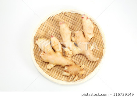 Fresh ginger in a colander Fresh ginger in a colander 116729149