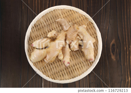 Fresh ginger in a colander Fresh ginger in a colander 116729213