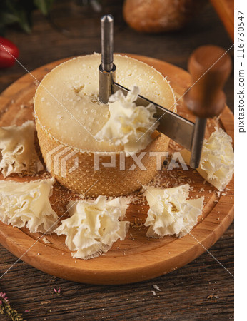 Cheese sliced with special knife 116730547