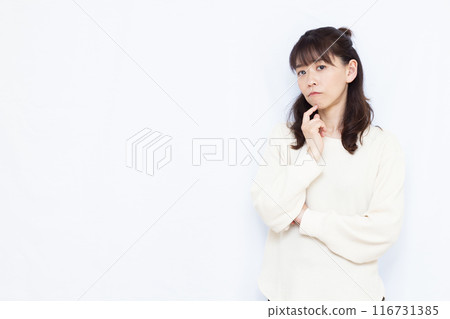 A woman who is seriously worried 116731385