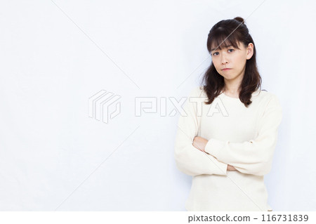 An angry woman with her arms crossed An angry woman with her arms crossed 116731839