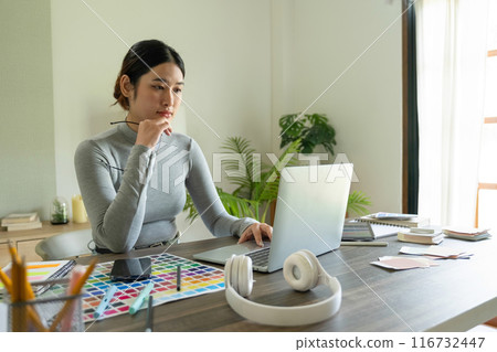 Young female architect envisions project with technology. Young female architect envisions project with technology. 116732447