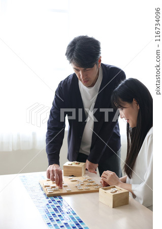 Men and women playing shogi Men and women playing shogi 116734096