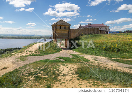 Ancient wooden fortress on a background of river spaces. Russia, Tatarstan, ancient Bulgar fortress in Yelabuga Ancient wooden fortress on a background of river spaces. Russia, Tatarstan, ancient Bulgar fortress in Yelabuga 116734174