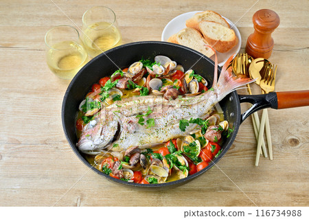 Red sea bream aquapazza, Italian cuisine, red sea bream, clams, cherry tomatoes, Italian parsley, white wine, bread. 116734988
