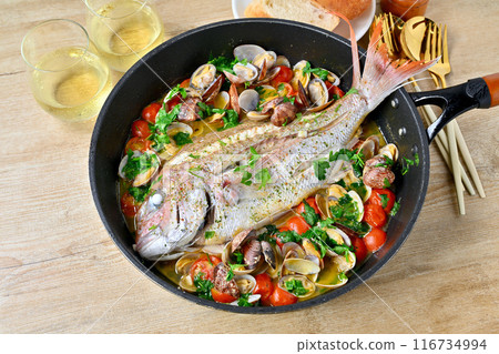 Red sea bream aquapazza, Italian cuisine, red sea bream, clams, cherry tomatoes, Italian parsley, white wine, bread. 116734994