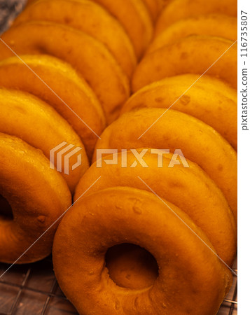 Freshly Baked Glazed Donuts 116735807