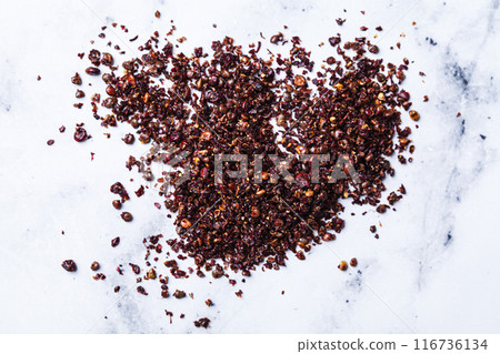 Dried spice sumac - popular ingredient in Middle Eastern cuisine. Dried spice sumac - popular ingredient in Middle Eastern cuisine. 116736134
