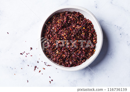 Dried spice sumac - popular ingredient in Middle Eastern cuisine. Dried spice sumac - popular ingredient in Middle Eastern cuisine. 116736139