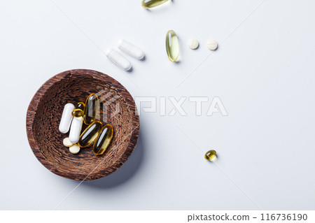 Capsules and tablets of vitamins. Health and beauty concept. Capsules and tablets of vitamins. Health and beauty concept. 116736190