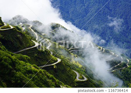 Old Silk Route Zig Zag Road Background with white Cloud 116736414