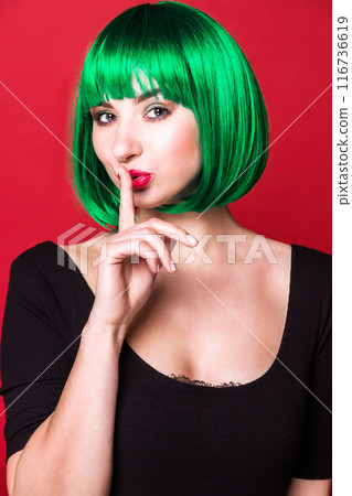 Woman with Green Hair Making Shushing Gesture Woman with Green Hair Making Shushing Gesture 116736619