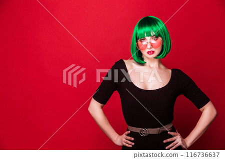 Confident Woman with Green Hair and Pink Sunglasses in Black Outfit 116736637