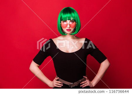 Confident Woman with Green Hair in Pink Sunglasses Confident Woman with Green Hair in Pink Sunglasses 116736644