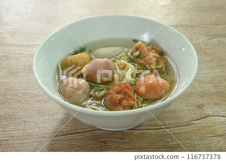 boiled Hakka meatball made from chop pork stuffing fried tofu with bean sprout andl ettuce in soup on bowl boiled Hakka meatball made from chop pork stuffing fried tofu with bean sprout andl ettuce in soup on bowl 116737378